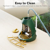 Demonstration of the easy-to-clean feature of the Nafnti feeder, with the top cover disassembled and water rinsing the interior for simple maintenance.